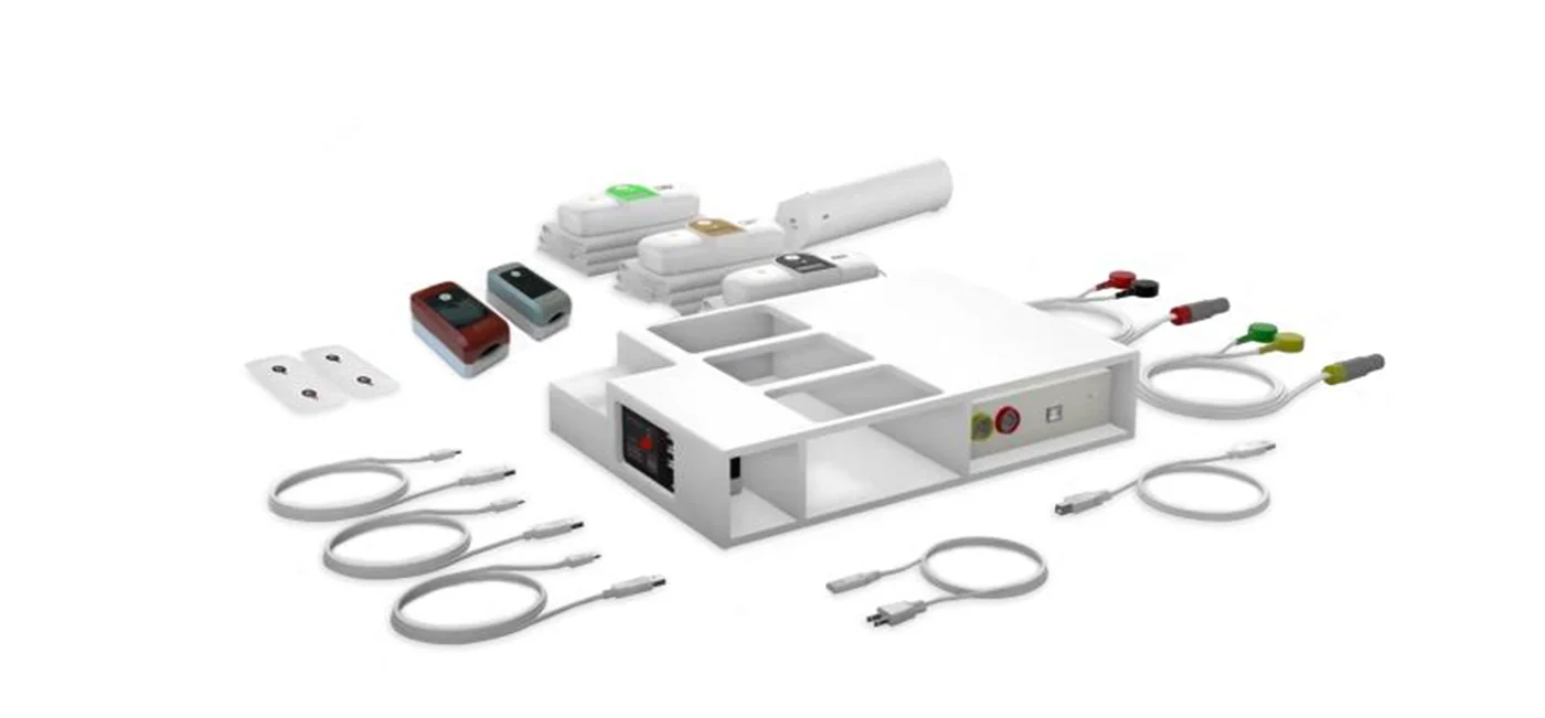 The TM Flow equipment set: blood-pressure cuffs, finger sensors, electrodes, and charging station